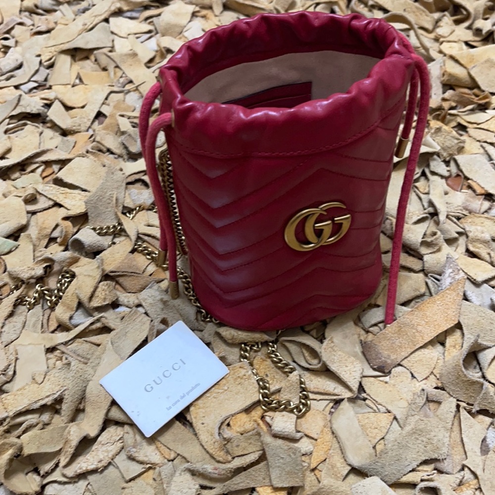 - Red leather Gucci bucket bag